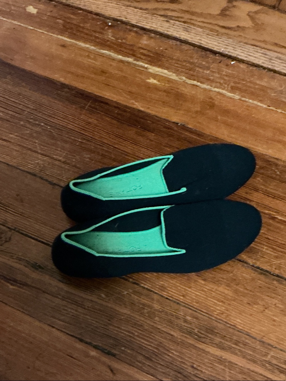 Rothy's Black Slip-On Loafers with Bright Green Interior